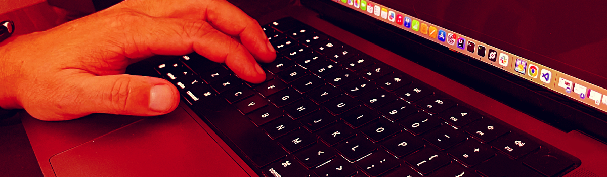 someone working on their computer with a flow chat on their left